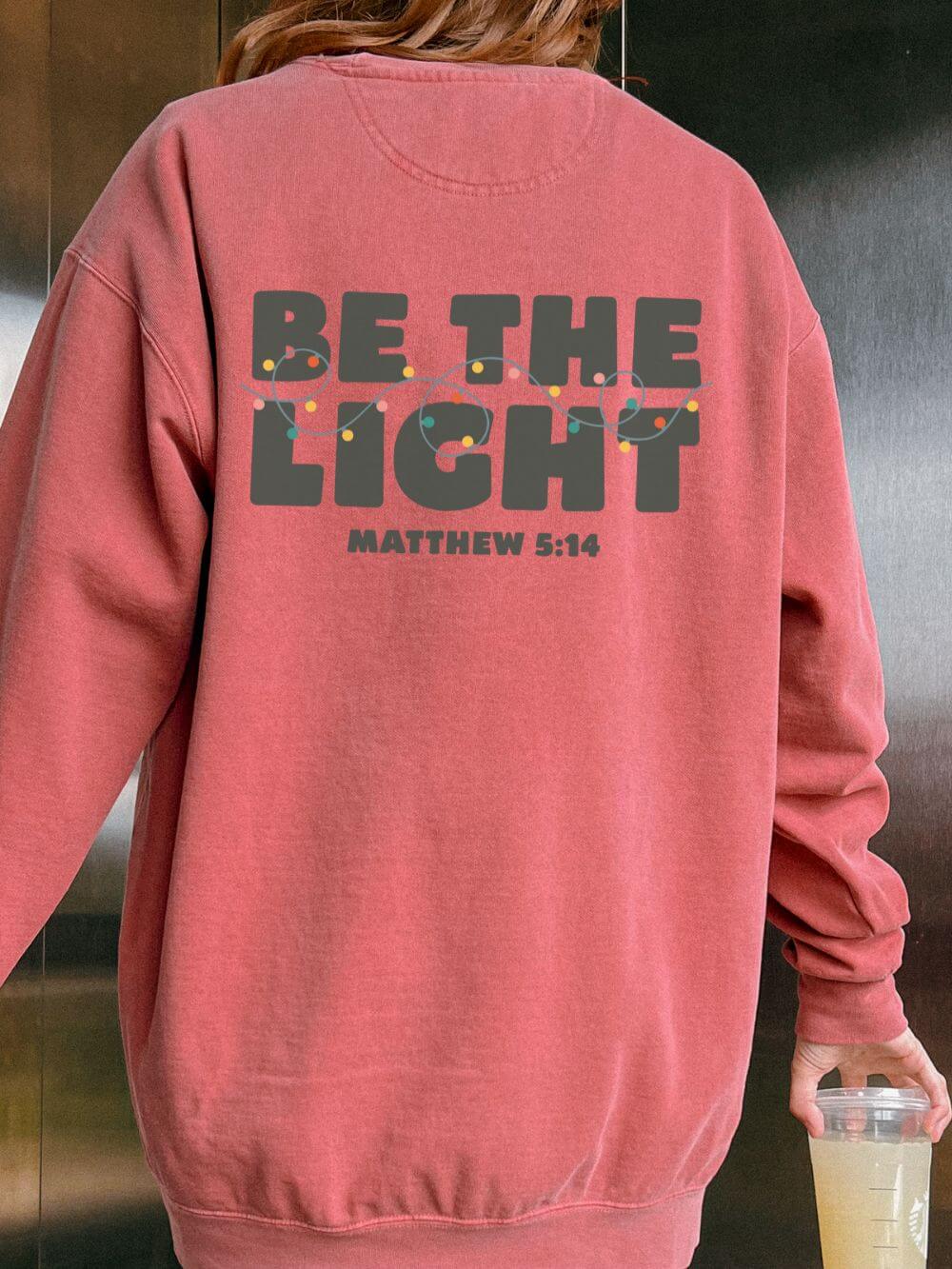 Be The Light Matthew 5:14 Christian Faith Comfort Colors Christmas Crewneck Sweatshirt - Sydney So Sweet