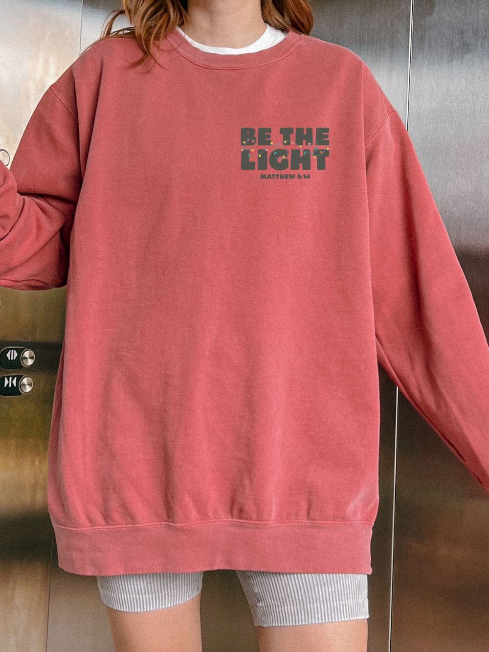 Be The Light Matthew 5:14 Christian Faith Comfort Colors Christmas Crewneck Sweatshirt - Sydney So Sweet