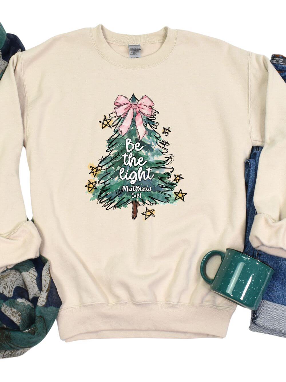 Be the Light  Christmas Tree Heavy Blend Unisex Crewneck Graphic Sweatshirt - Sydney So Sweet