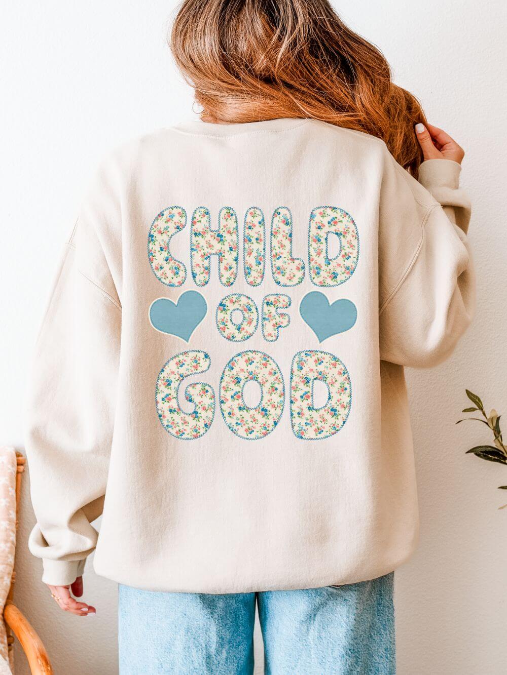 Child of God Christian sweatshirt for women with floral cross graphic