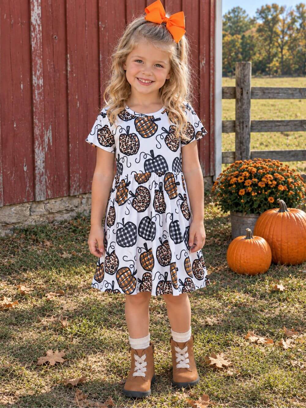 Girl wearing farmhouse pumpkin patch dress